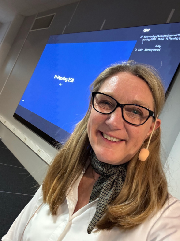 Karin Anding wearing headset on PI -planning